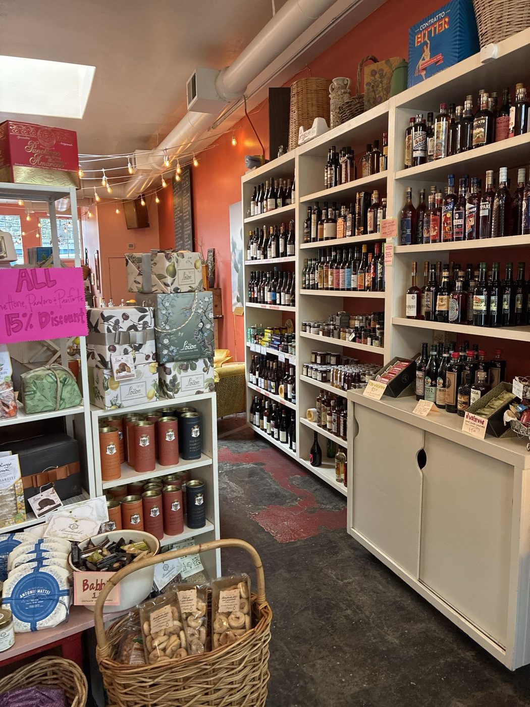 Wine shelves and retail displays inside La Medusa Sicilia.