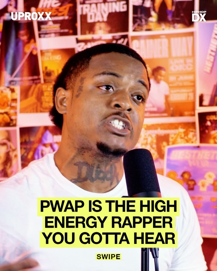 Oklahoma City rapper PWAP speaking into a microphone at a live event